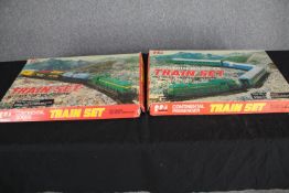 Two Mehano train sets. Continental goods. H.58 W.37cm. (each)