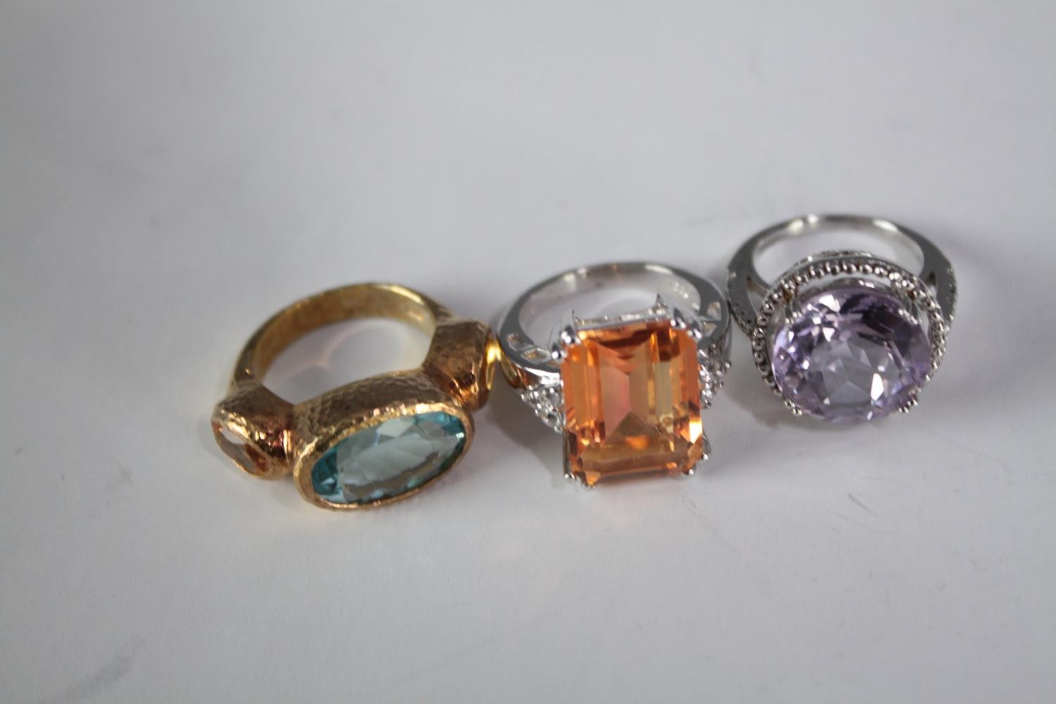 A collection of ten silver gem-set rings of various designs. Set with blue topaz, amethyst and ruby. - Image 2 of 4