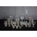An assortment of mixed glass. Including sherry, wine and shot glasses and two jugs. H.28cm. (