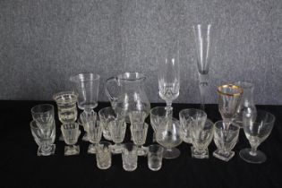 An assortment of mixed glass. Including sherry, wine and shot glasses and two jugs. H.28cm. (