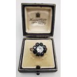 A boxed vintage sapphire and diamond platinum and 18ct white gold statement floral cluster ring. Set