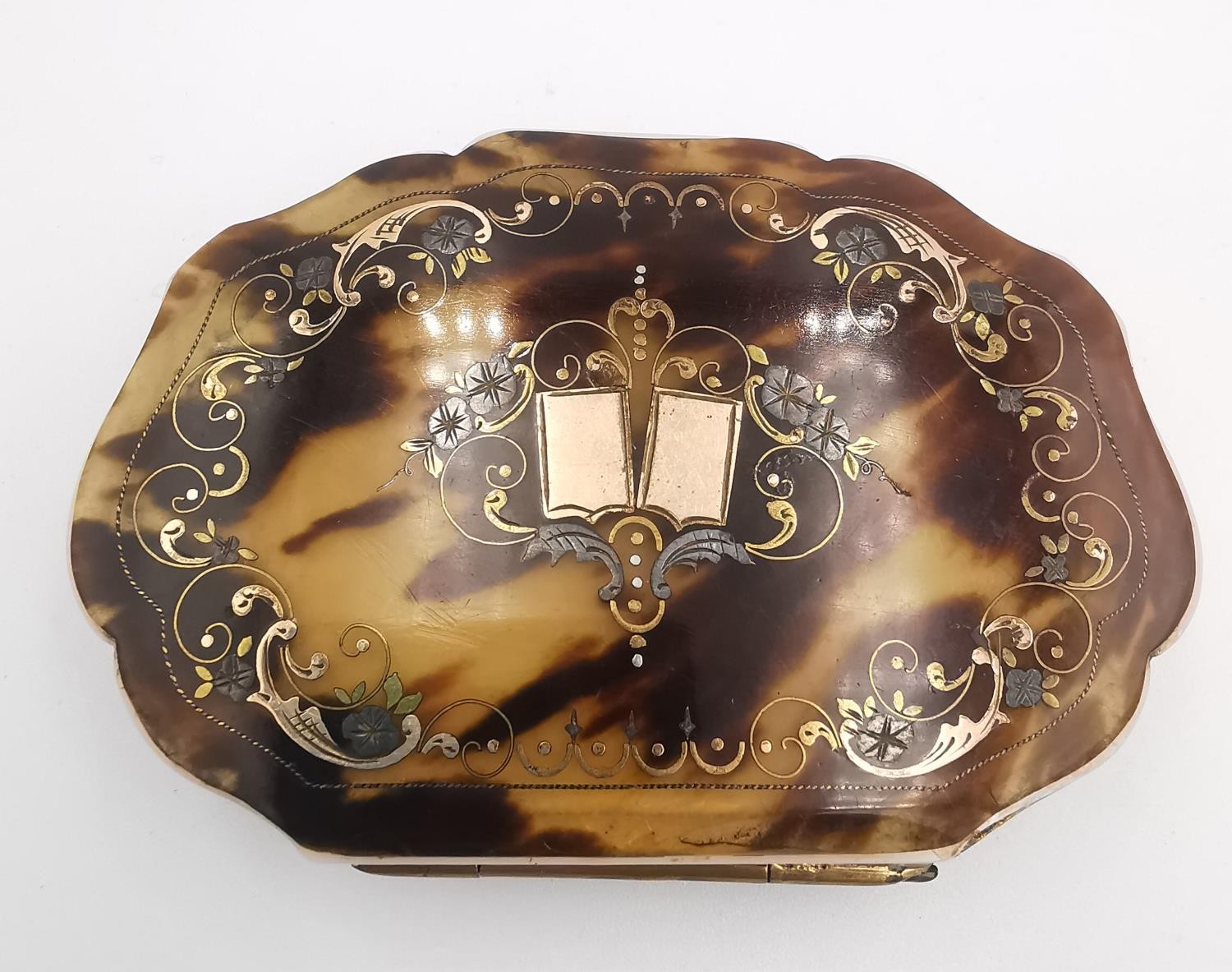 A Victorian pique work purse converted into a travelling photo frame. The scalloped front inlaid