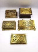 A collection of five 19th century and early 20th century brass stamp boxes, including one with a