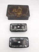 Three 19th century lacquered snuff boxes, one of rectangular form with painted red interior with