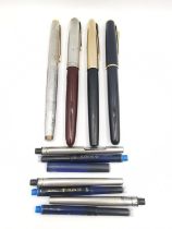 Four vintage four fountain pens, including a black Parker Sonnet with 18k gold nib, a vintage Parker