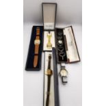 A collection of vintage watches and a boxed gilded silver Pierre Cardin keyring. Watches include a