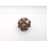 A 14 carat rose gold multi gemstone Harem Thai princess ring. Set with seventeen round mixed cut