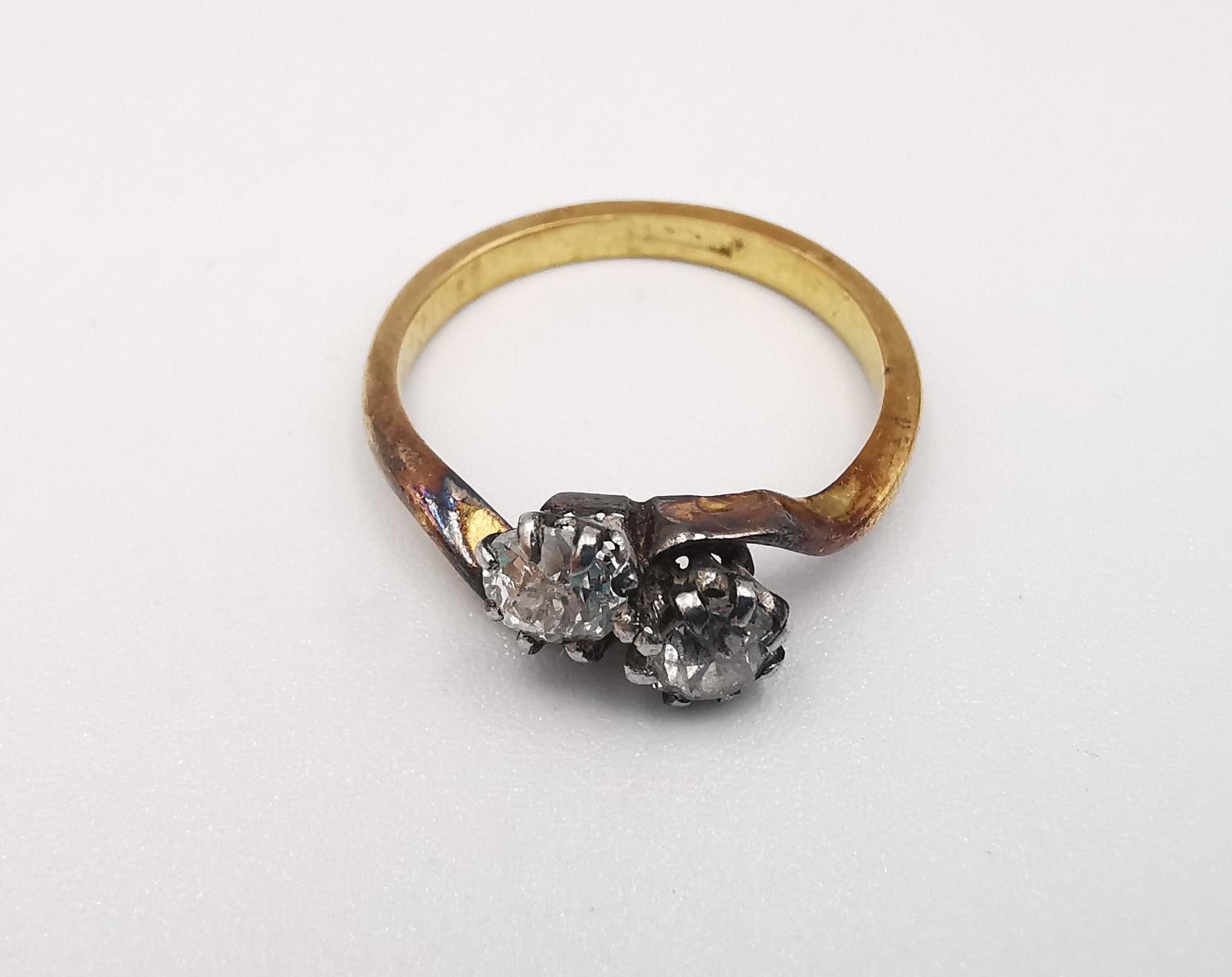 An 18ct yellow gold old mine diamond cross over ring. Set with two cushion shaped old mine - Image 2 of 4