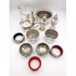 A collection of silver and silver plate, including salt and pepper shaker, a pair of repousse floral