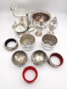 A collection of silver and silver plate, including salt and pepper shaker, a pair of repousse floral