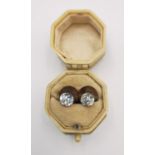 A pair of Victorian yellow metal (tests as 9ct gold) and cut paste shirt studs in an Art deco