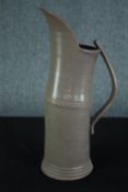 Walter Keeler, British, 1942-, a tall 'Articulated' salt-glaze stoneware jug, with applied strap