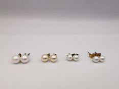 Four pairs of round cultured pearl stud earrings, three pairs with 9ct posts and butterflies. One