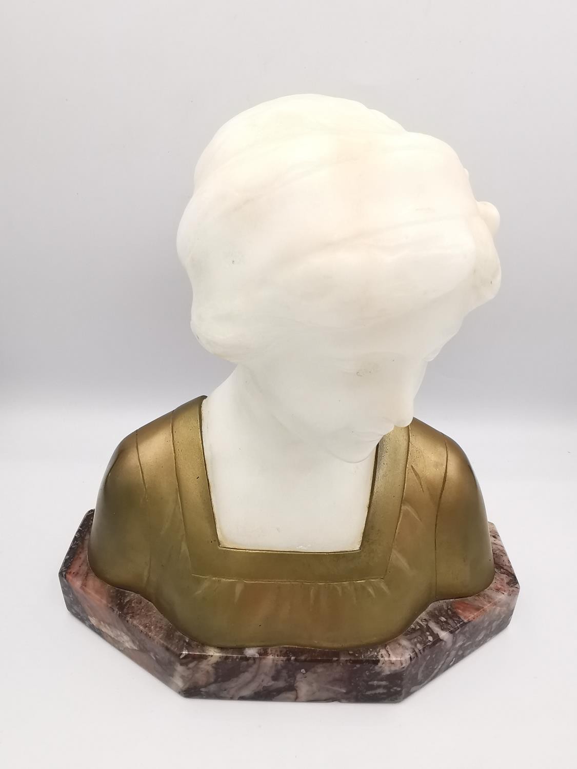 Richard Pauli (1855-1892), a carved white marble and gilded bust of a young lady in a dress, mounted