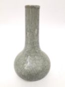 A early 20th century Ge style ware celadon crackle glaze bottle vase. Unglazed foot. H.19cm