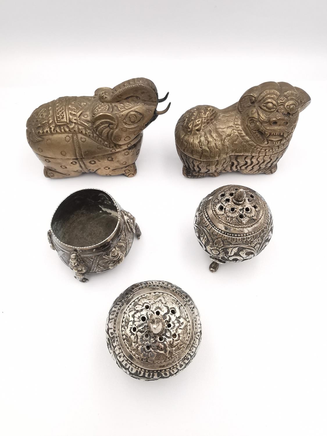A collection of Indian and Chinese white metal items (tests as silver), including two repousse