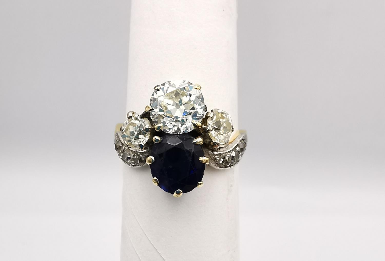 An Art Nouveau old mine diamond and sapphire two stone yellow (18ct gold) and white metal (platinum)