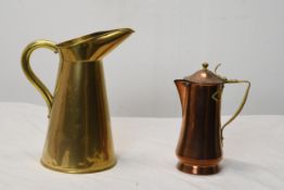 A early 20th century brass jug and a brass and copper lidded coffee pot. H.26