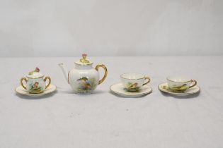 A Royal Worcester hand painted two person complete dolls tea set, painted by D. Jones. Each piece