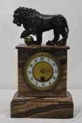 A 19th century marble mantel clock with a bronze Medici lion surmount. H.37 W.17 D.13