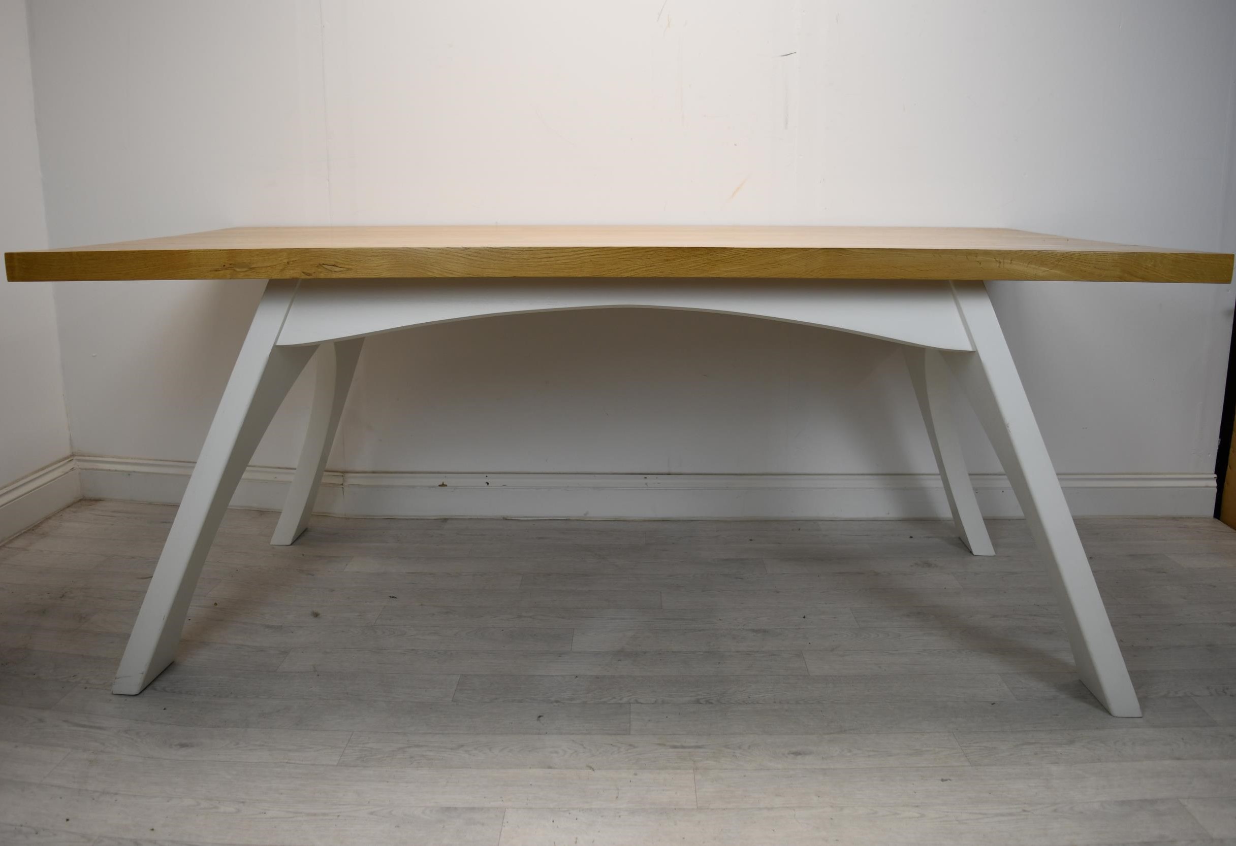 A contemporary oak topped dining table on painted base. H.79 W.200 D.100