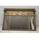 A Regency giltwood and gesso overmantel with classical frieze and triple plates flanked by