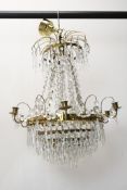 A Swedish Lead Crystal basket chandelier with gilt metal frame and crystal swags and drops.
