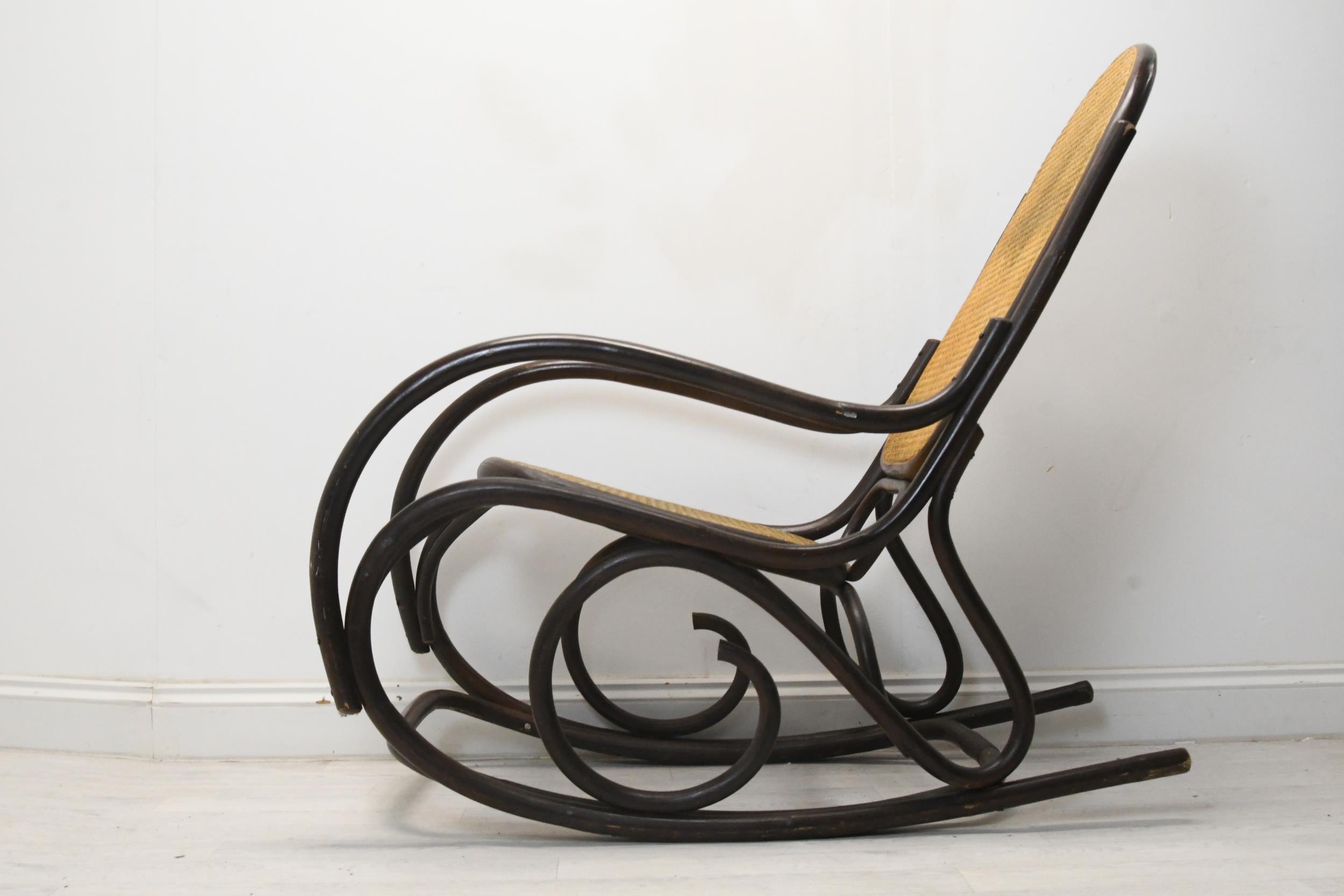 A vintage bentwood rocking chair with caned back and seat. H.110 W.55 D.110 - Image 2 of 4