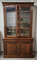 A 19th century style mahogany library bookcase, in two sections. H.223 W.130 D.60
