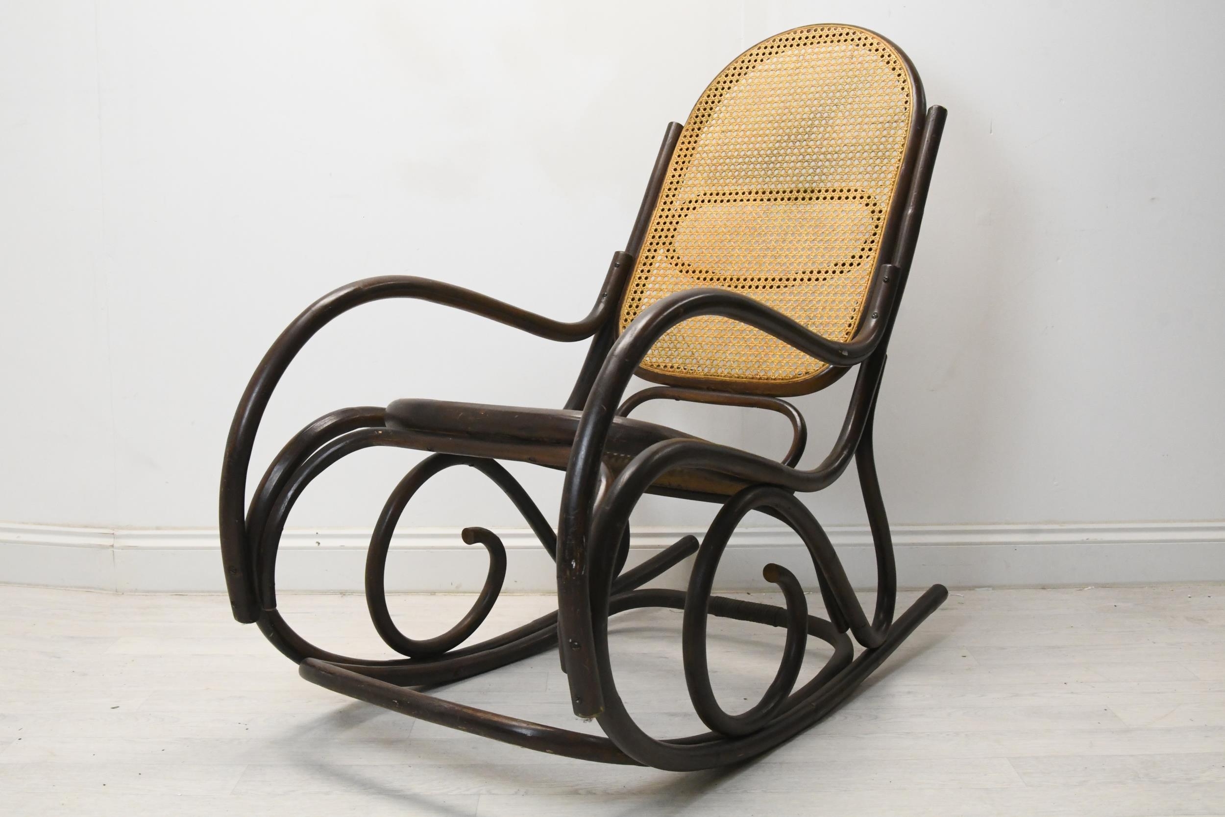 A vintage bentwood rocking chair with caned back and seat. H.110 W.55 D.110