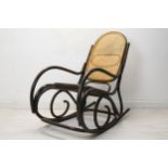 A vintage bentwood rocking chair with caned back and seat. H.110 W.55 D.110