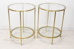A pair of contemporary brass and glass lamp tables. H.62 D.46