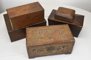 An miniature carved Chinese chest and other wooden boxes. Early twentieth century. The largest