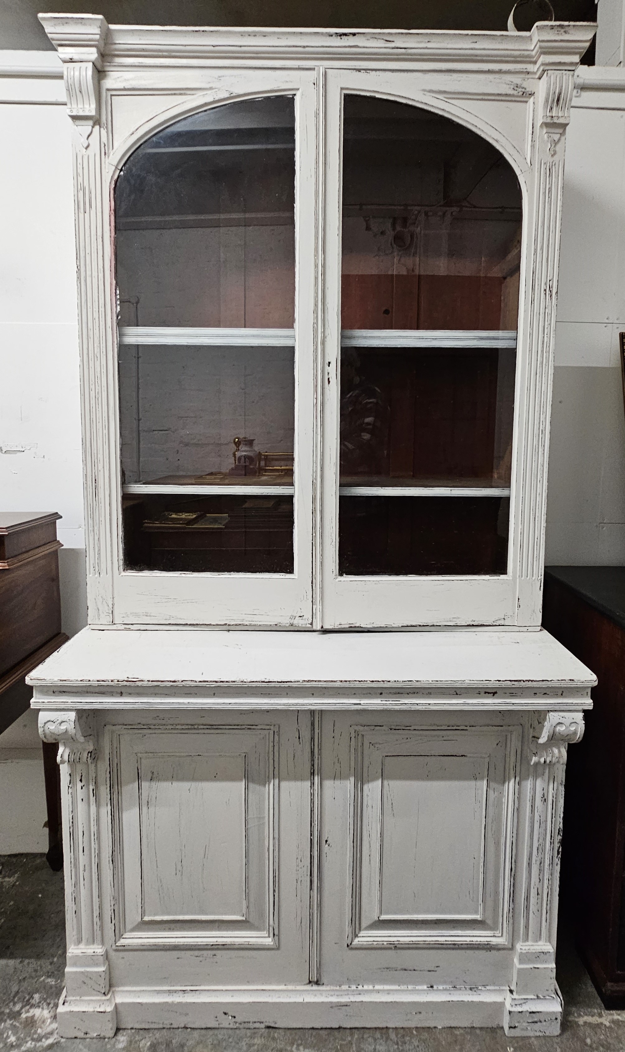 A late 19th century two section library bookcase, mahogany, later painted. H.224 W.115 D.77