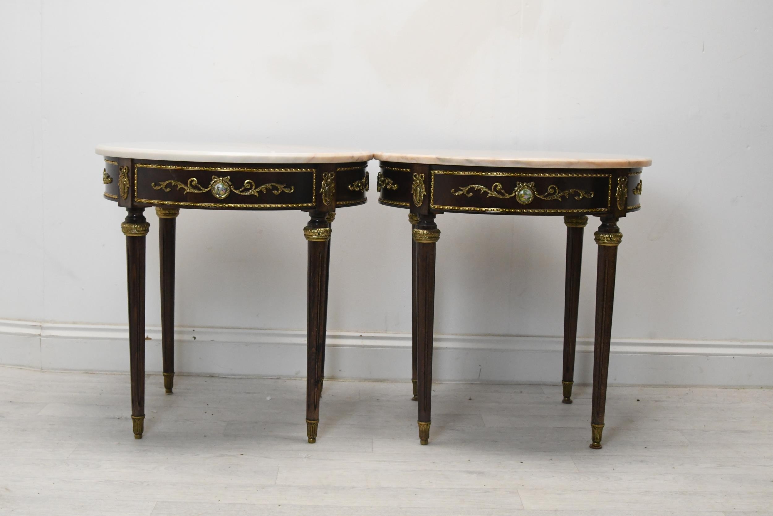 Lamp or occasional tables, a pair, marble topped mahogany Empire style with ormolu mounts. H.60