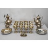 A collection of silver plated items, including an engraved silver plate three piece coffee set, a