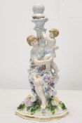 A 19th century Meissen style hand painted porcelain mother and child figural candle stick with