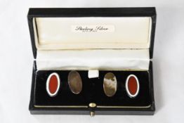 A pair of cased sterling silver cufflinks.
