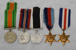 A collection of medals with ribbons.