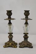 A pair of vintage brass and glass candlesticks. 25cm high