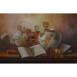 W. M. Steiner, a framed oil on canvas still life depicting an open book, a vase and fruit. Signed.