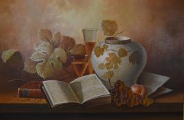 W. M. Steiner, a framed oil on canvas still life depicting an open book, a vase and fruit. Signed.