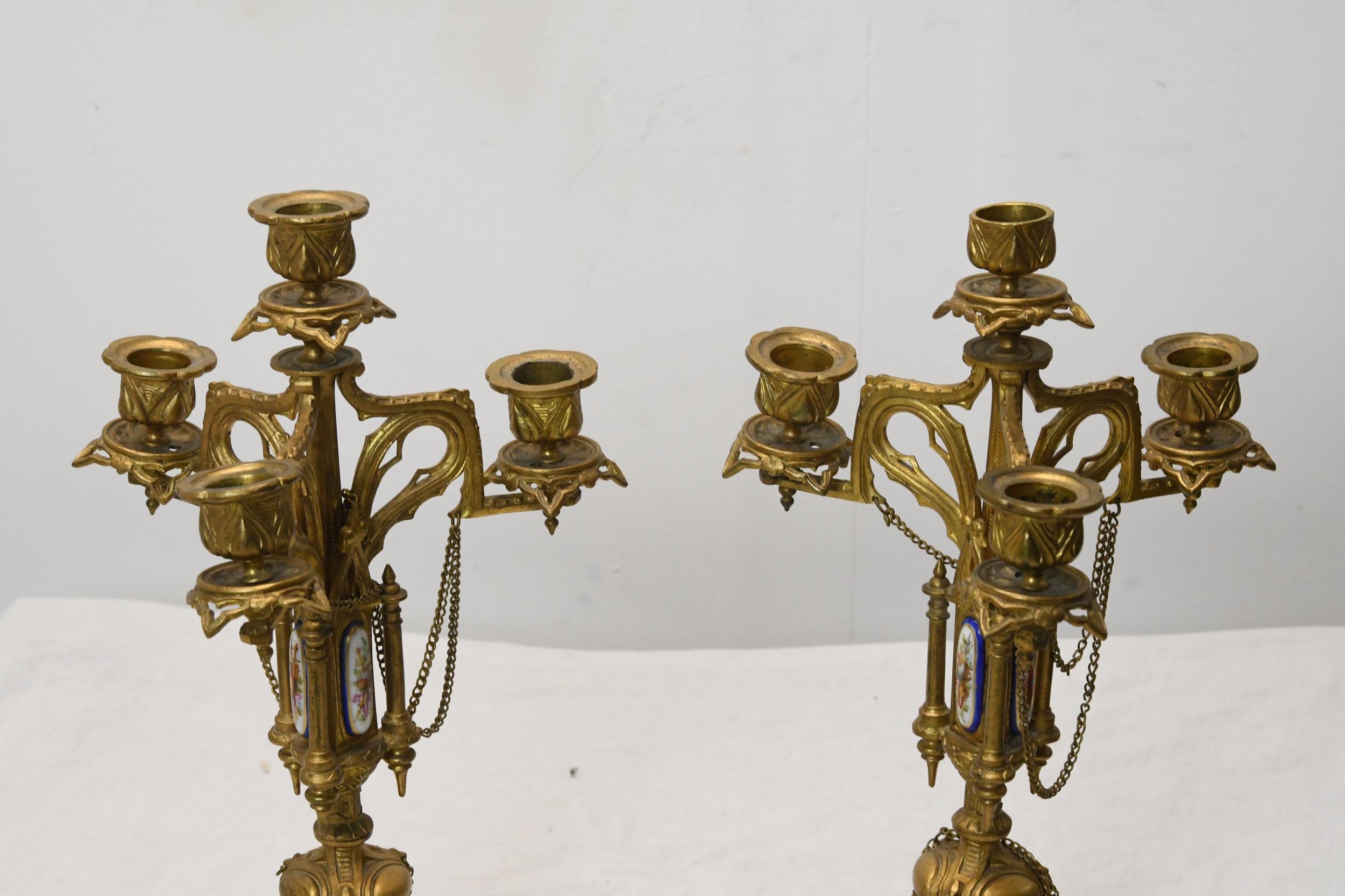 A pair of early 20th century Gothic style gilt metal four branch candelabras with hand painted - Image 2 of 3