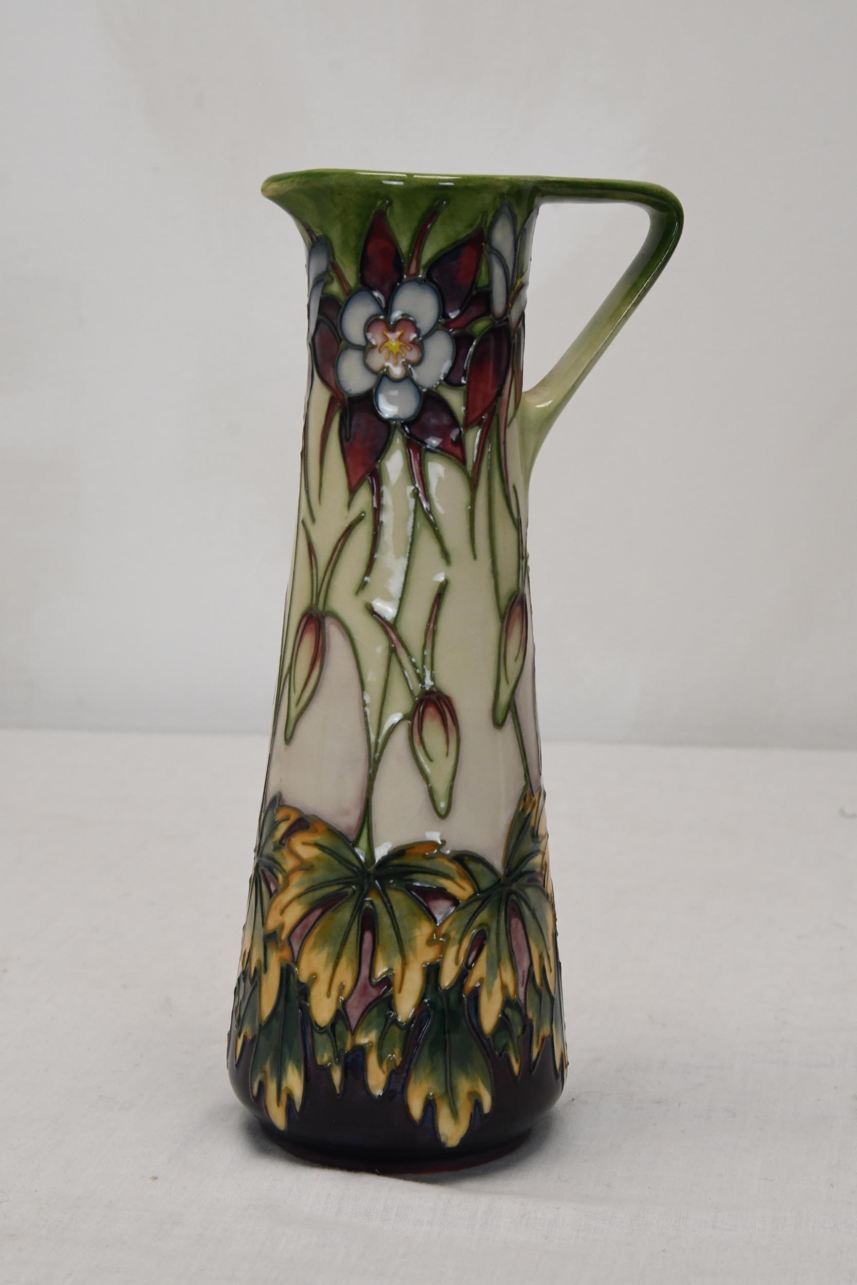 A Moorcroft pottery Aqueligia vase. H.24 W.13 D.9