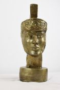 A resin head of a Roman Centurion painted in gold. H.51 W.17 D.21 cm.
