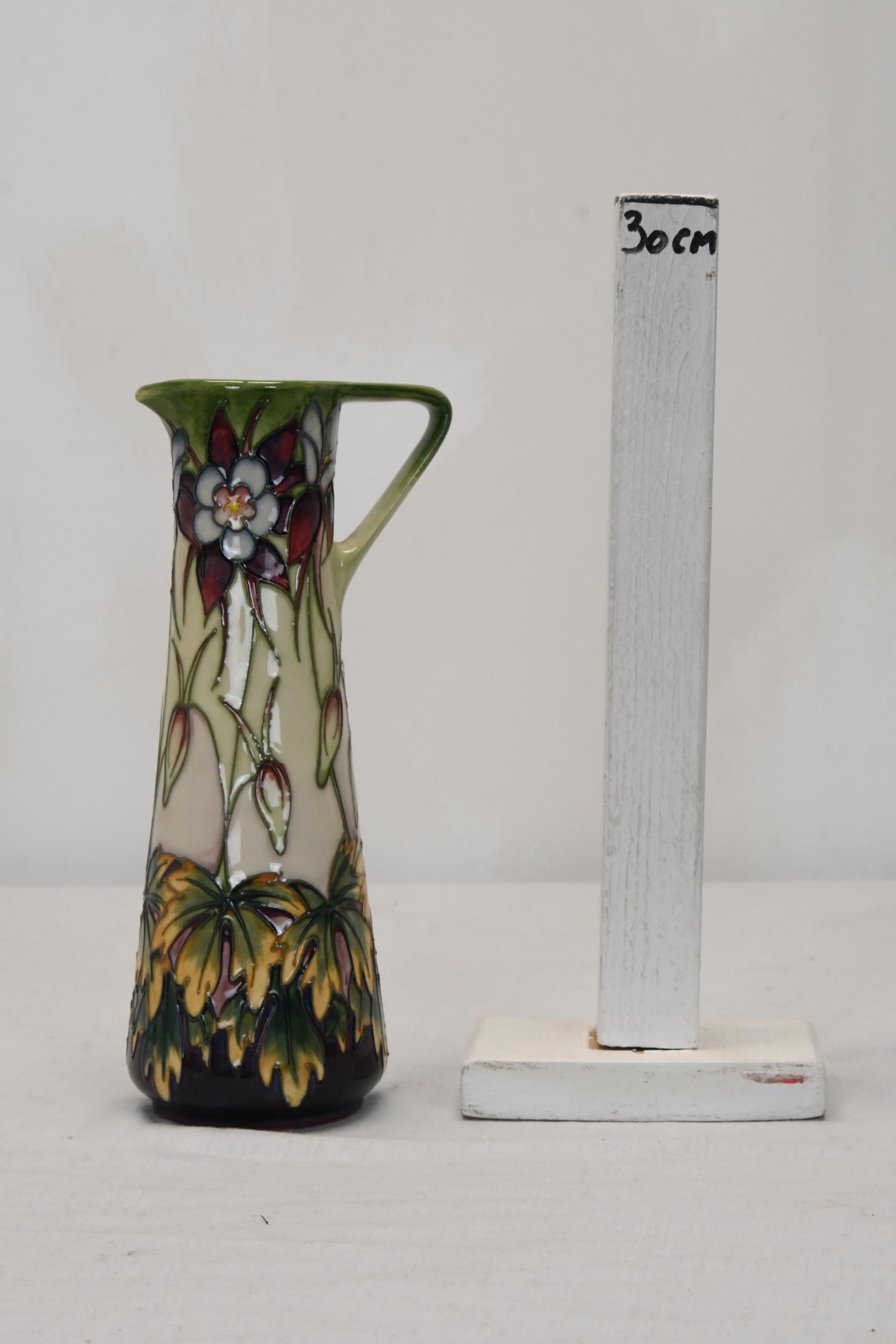 A Moorcroft pottery Aqueligia vase. H.24 W.13 D.9 - Image 2 of 3