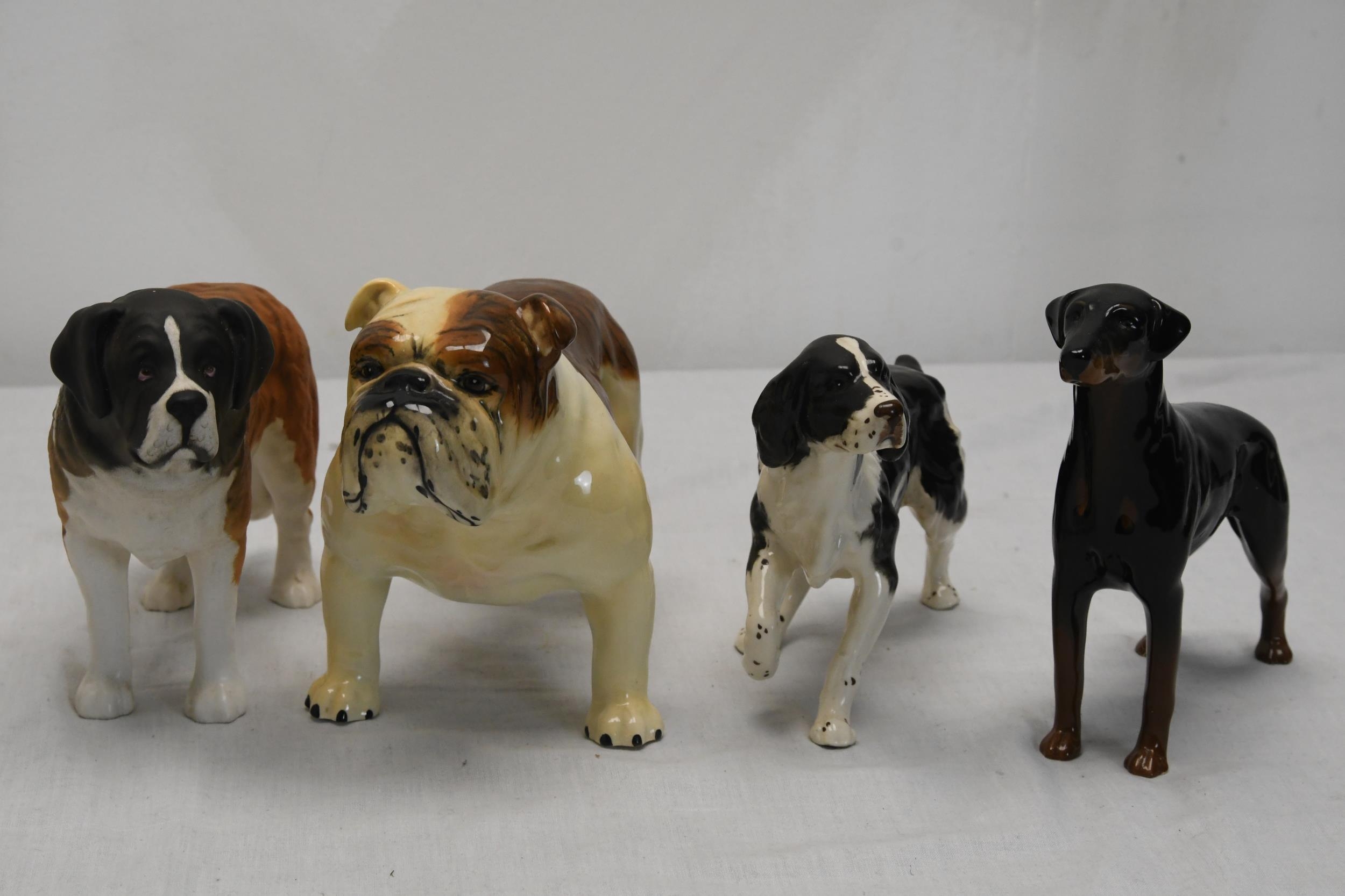 A collection of Beswick ceramic dogs.