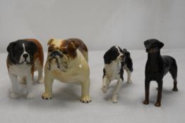 A collection of Beswick ceramic dogs.