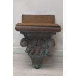 A moulded downpipe hopper in the form of a classical corbel with fitted copper sink insert. H.72 W.