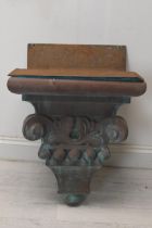 A moulded downpipe hopper in the form of a classical corbel with fitted copper sink insert. H.72 W.